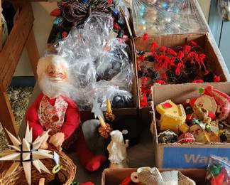 Table of vintage Christmas lights, ornaments and decorations