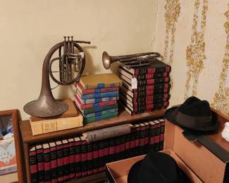 Vintage Brass horns, encyclopedia, Holy Bible   bookcase,  mirror 