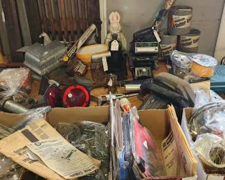 Vintage aluminum gutter guards , vintage plastic Easter bunny candy container , vintage hot shot sprayer, weedeater string  circular saw, vintage car radios, fm converter, antennas, trailer lights  vintage rare vacuum cannister sprayer, tons of hardware and hand tools, multiple grease guns of various sizes