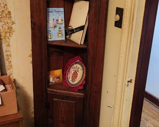 Corner cupboard,  bric a brac, school annual
