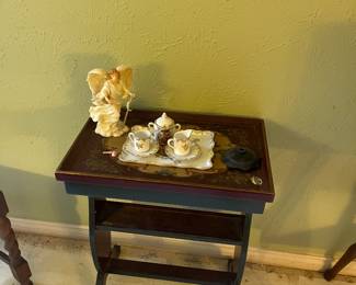 Vintage two-tier stretcher side table featuring a decorative crackle-painted finish and a lower storage shelf