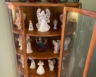 Gorgeous oak display cabinet with a curved glass door