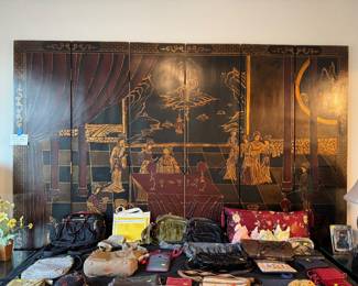 King size bed with oriental panels screen as the headboard