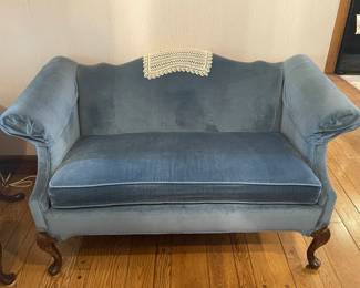 Victorian-style revival camel back, blue velvet, loveseat with walnut legs 