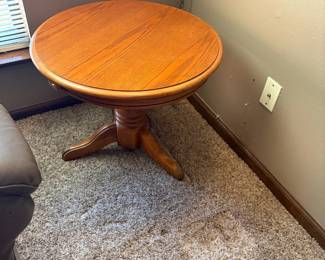 one of two round side tables