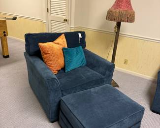 Navy Blue Upholstered Armchair with Ottoman and Decorative Pillows