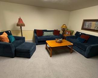 Dark Blue Upholstered Sectional Sofa with Ottoman and Accent Pillows