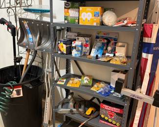 Assorted Home Improvement and Lighting Supplies on Metal Shelving Unit