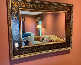 Ornate Black and Gold Gilt Mirror with Scrollwork and Floral Motifs