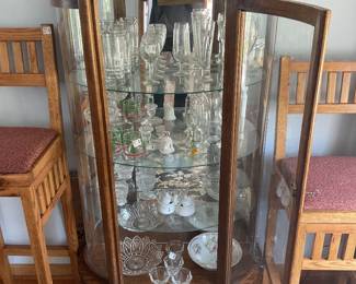 Lighted curio cabinet with glass shelves