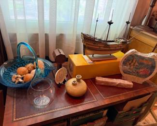 Leather top table, blue glass basket, ship