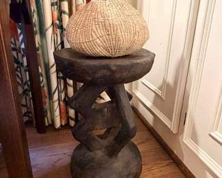 African Tonga stool made of artifact wood and small garlic gourd basket