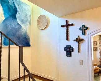 Wall adorned with crosses of various materials and age!