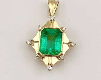 4.49kt Columbian emerald with 18k gold and diamond setting. GIA certificate and appraisal report included
