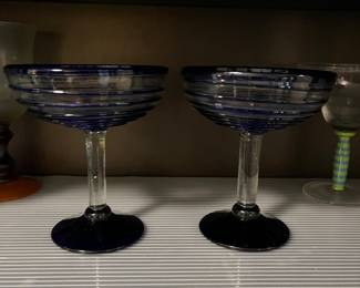 several sets of handblown glass margarita glasses