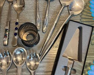 several salad & serving flatware sets
