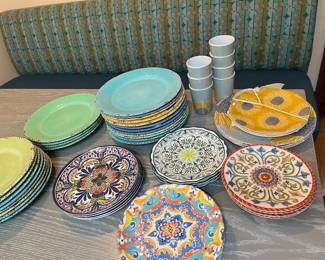 several sets of colorful melamine plates