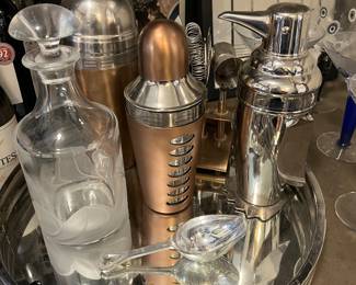 lots of barware including cocktail shakers, decanters, etc