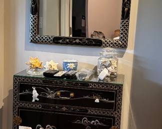 Black lacquered side cabinet with mother of pearl design with mirror