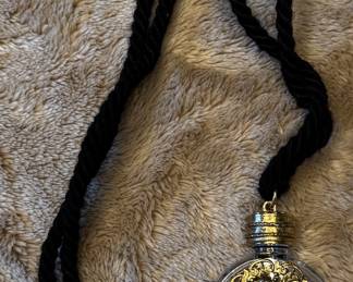 Necklace with a small bottle 