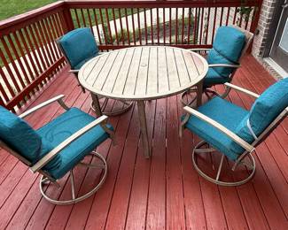 Outdoor Dining Set with Swivel Chairs and Teal Cushions