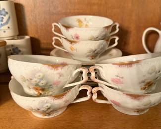 Theodore Haviland Limoges pieces featuring delicate floral patterns and gilt trim