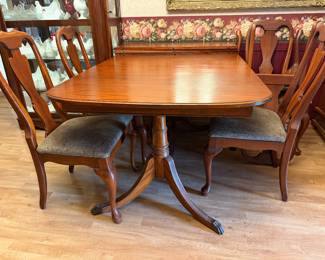 Antique dining table with 6 chairs and two leaves