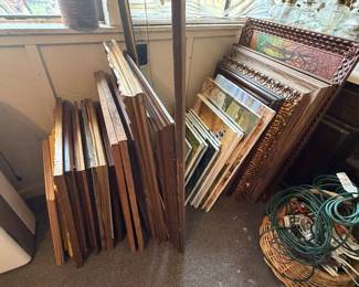 Ornate wooden frames and oil paintings