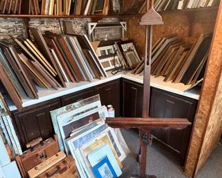 Ornate wooden frames and oil paintings