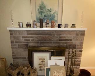 Living room fireplace with decor and art work