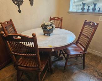 Marble top table with 4 antique chairs