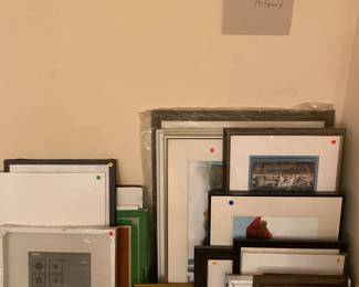 A stack of original signed artwork