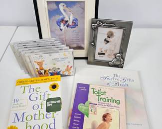 Lot #97 - Motherhood Lot - Baby Einstein CDs, Several Books, Teddy Bear Photo Frame, Stork With Twin Babies Framed Print