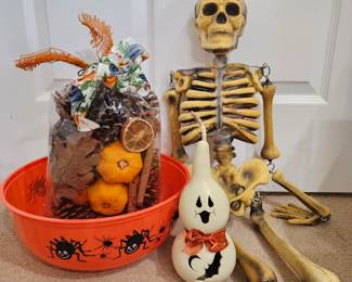 Lot #196 - Halloween Decor - Skeleton, Ghost Candle, Plastic Candy Bowl & Large Bag of Purely Pumpkin Potpourri