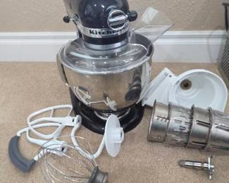 Lot #183 - KitchenAid Artisan Stand Mixer with Stainless Steel Bowl and Slicer & Shredder Attachment.