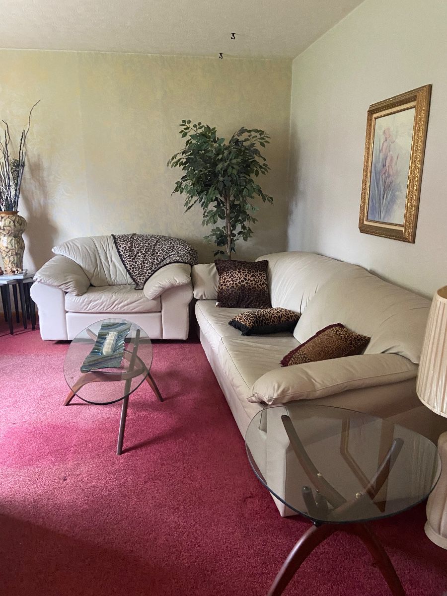 Nice leather sofa and swivel oversize chair