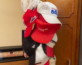 Several Firestone and INDY 500 hats