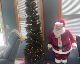 Christmas is sprinkled throughout the house.  This musical Santa will welcome you!