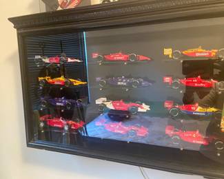 This lighted display cabinet has 12 CART/Indy diecast cars