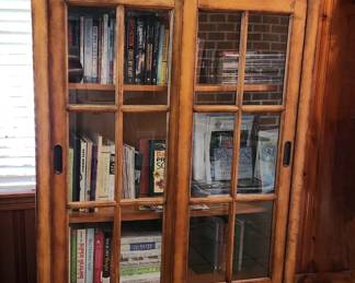 Lovely Bookcase with sliding doors, solid wood quality construction. A true statement piece for any room to protect your favorite books or collection 