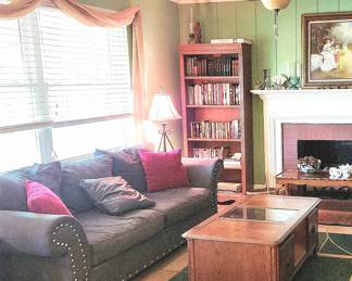 Charcoal Gray fabric sofa with upholstery tack accent