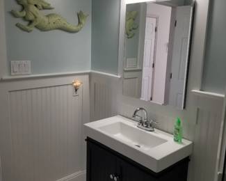 Updated bath vanity; mirrored medicine cabinet; vanity lights