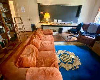 1970s velvet couch. Rugs.