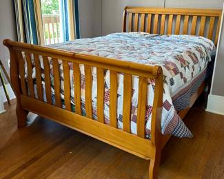 Wooden bed with mattress and boxspring