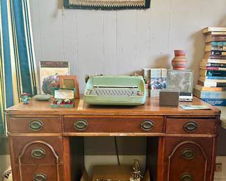Antique desk, typewriter, books