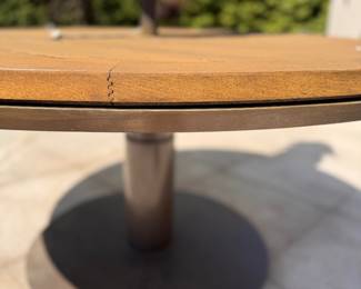 JANUS Et Cie 60" Round Teak Dining Table With Power Coated Steel Base - 2 Available. Measures 30" H. The Tables Are In Great Condition. Photo 3 of 4. 