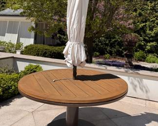 JANUS Et Cie 60" Round Teak Dining Table With Power Coated Steel Base - a Available. Measures 30" H. The Tables Are In Great Condition. Photo 2 of 4. 