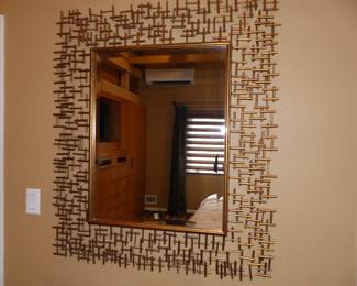 Modern abstract gold metal framed mirror