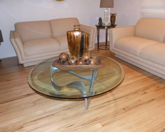 Modern round glass top abstract chrome base coffee table, bric-a-brac