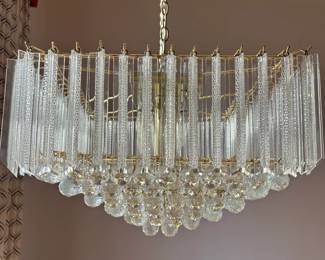 Modern chandelier has been taken down all the crystals have to be put back on